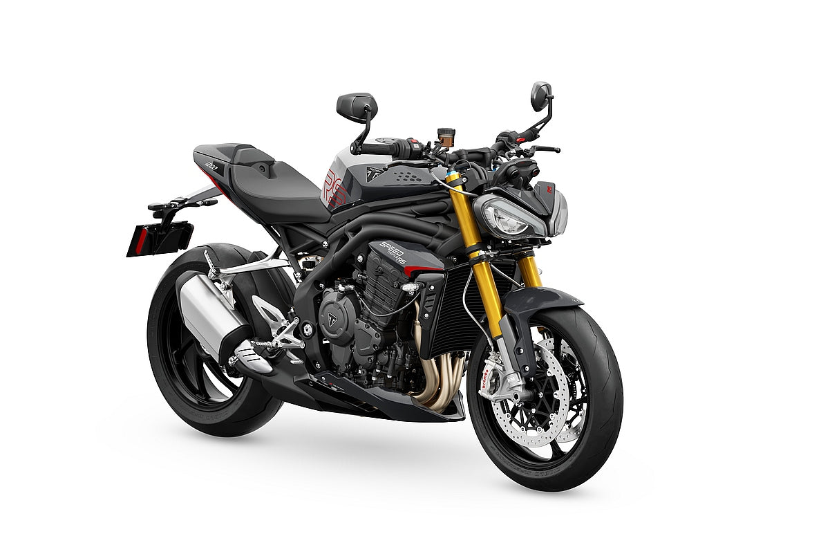 Triumph Speed Triple 1200 RS (2025+), real press studio photograph on white background at front three-quarter angle