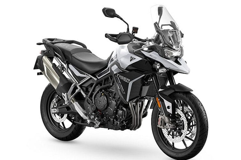 Triumph tiger-900-2024 real current-generation motorcycle studio front three quarter photo on white backdrop
