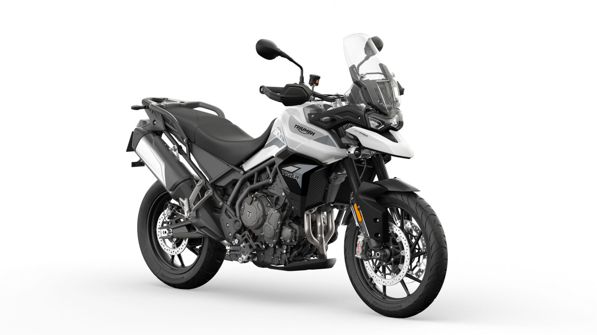 Triumph tiger-900-gt-2020 real current-generation motorcycle studio front three quarter photo on white backdrop