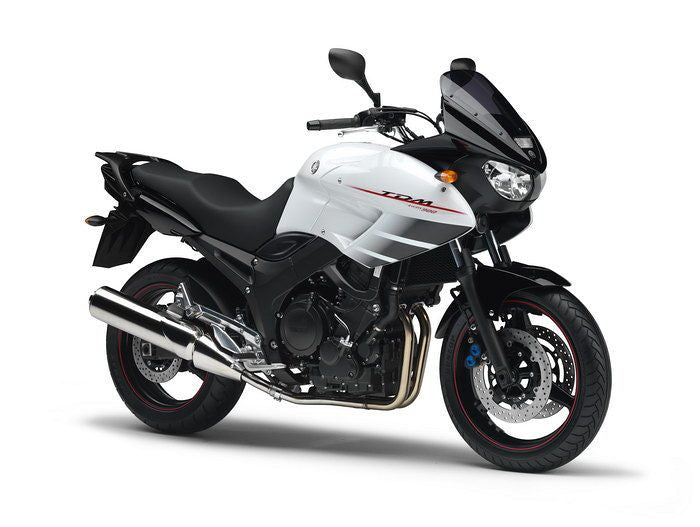 Yamaha TDM900 (2002–2014) original motorcycle on white background, front three-quarter studio photo